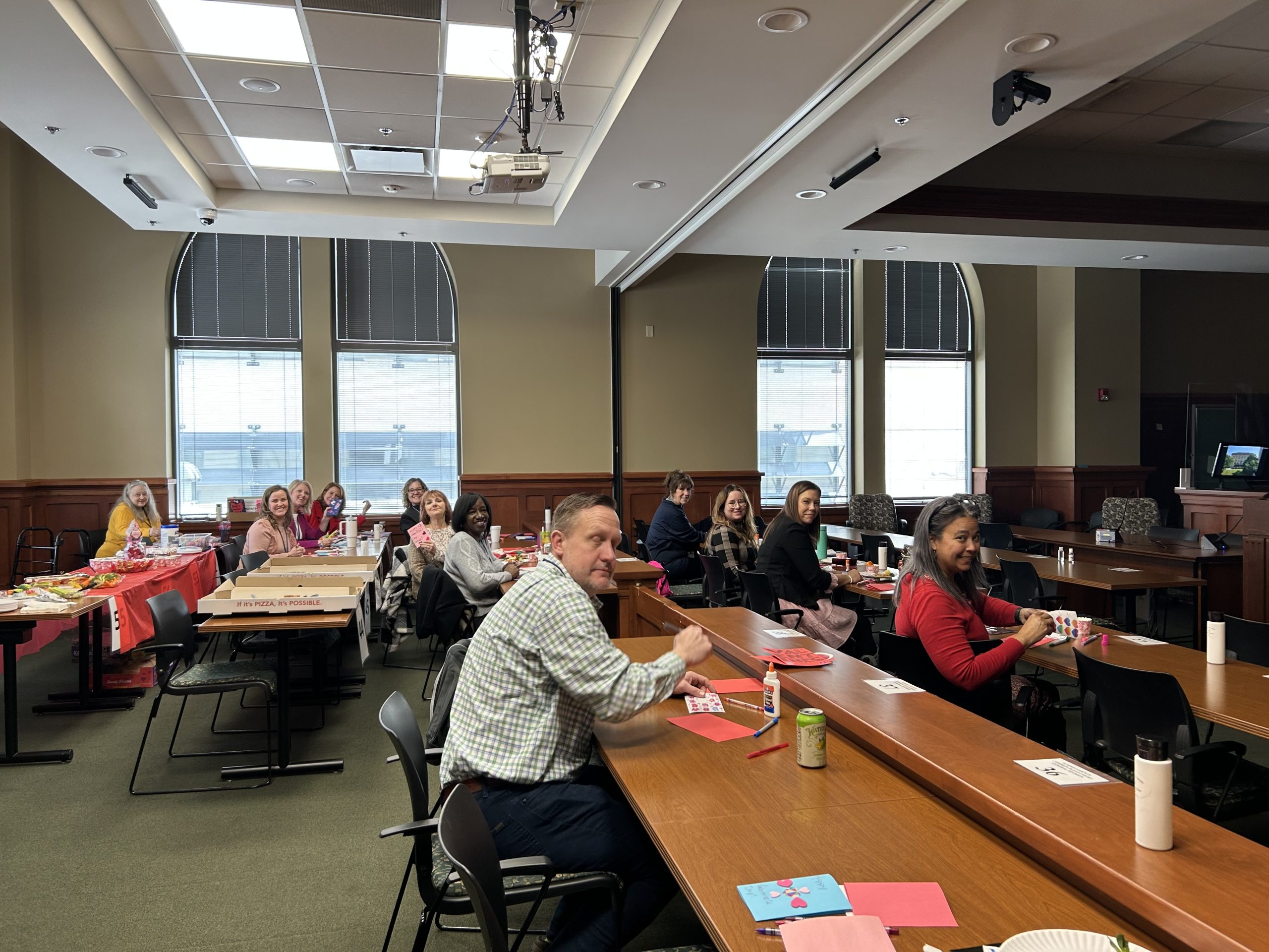 Operation Valentine 2025 - Magistrates and Service Staff Summit County Domestic Relations Court Staff making valentine day cards for troops in a large courtroom
